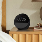Amazon Echo Spot (2024) Black on a bedside table showing alarm clock