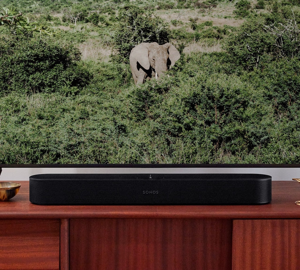 Sonos Beam Gen2 soundbar below television on living room console