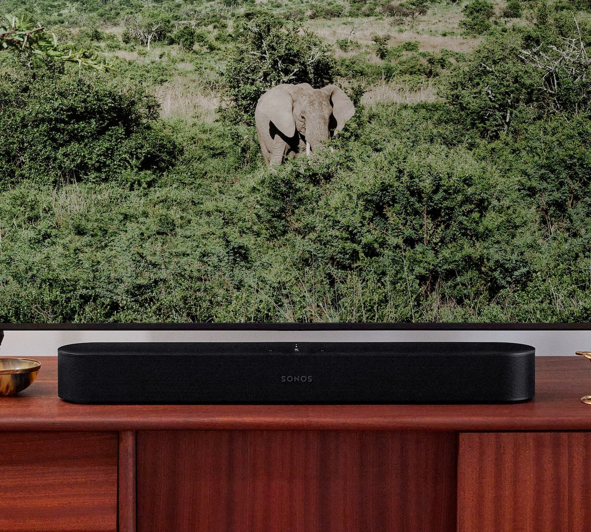 Sonos Beam Gen2 soundbar below television on living room console